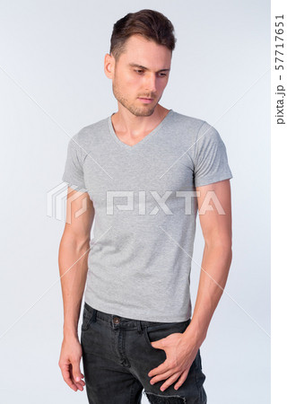Studio shot of handsome man with casual clothing Studio shot of handsome man with casual clothing 57717651