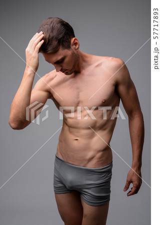 Studio shot of handsome muscular man shirtless 57717893