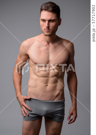 Studio shot of handsome muscular man shirtless 57717902