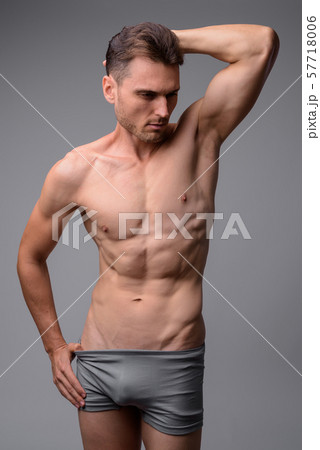 Studio shot of handsome muscular man shirtless 57718006
