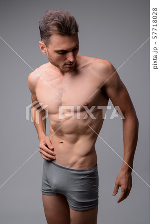 Studio shot of handsome muscular man shirtless 57718028