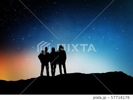 travelers or friends on edge over night sky 57718176
