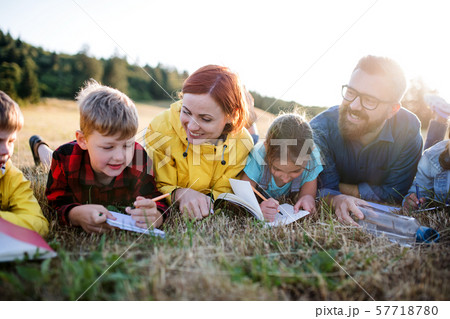 Group of school children with teacher on field trip in nature. Group of school children with teacher on field trip in nature. 57718780