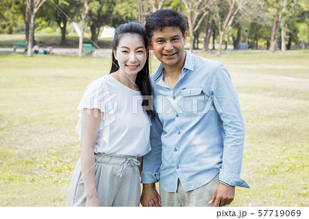 Adult male and female couples in the park. Adult male and female couples in the park. 57719069