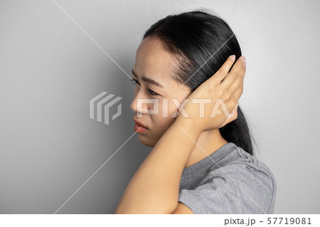 Young woman is suffering of earache. Young woman is suffering of earache. 57719081