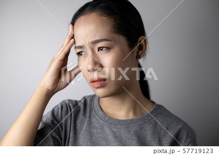 Young woman with of stress and headaches. Young woman with of stress and headaches. 57719123