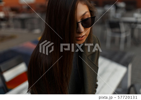 Portrait of a stylish and young brunette girl  57720131