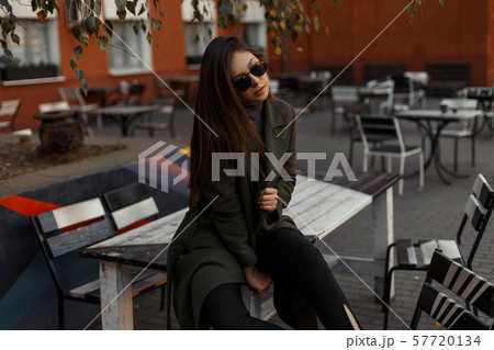 A young and beautiful fashionable brunette woman 57720134