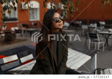 Attractive girl in stylish black sunglasses  57720137