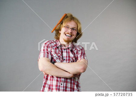 Man having problem with brushing hair 57720735
