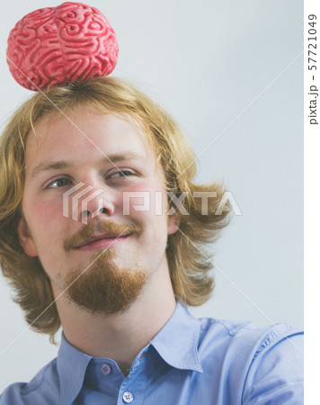 Man playing with human brain Man playing with human brain 57721049
