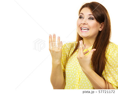 Pretty teen woman gesturing with hands 57721172