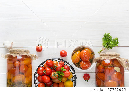 Canned vegetables tomato in glass jars. 57722096
