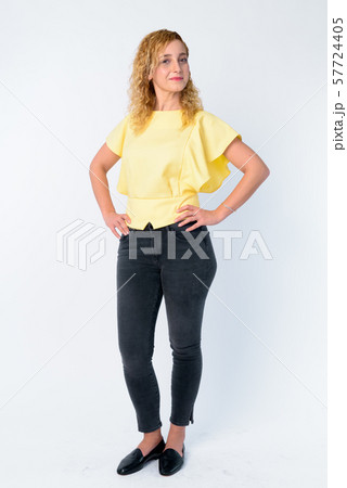 Full body shot of beautiful woman with curly blond hair 57724405