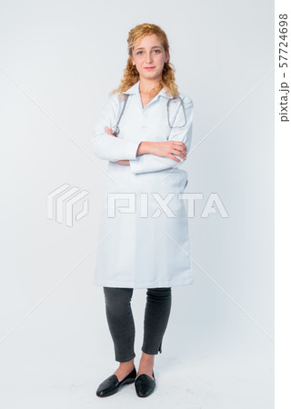 Full body shot of beautiful blonde woman doctor with arms crossed 57724698
