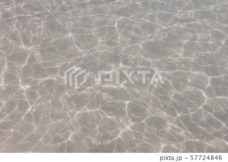 Clear water surface with white sand. 57724846