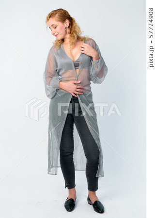 Full body shot of beautiful woman with curly blond hair Full body shot of beautiful woman with curly blond hair 57724908