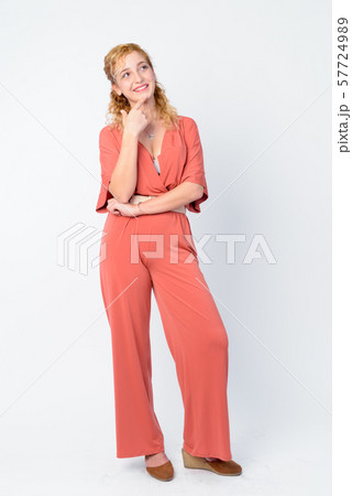 Full body shot of happy beautiful blonde woman thinking and looking up 57724989