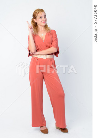 Full body shot of beautiful blonde woman pointing up 57725040
