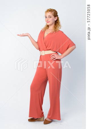 Full body shot of beautiful blonde woman showing something Full body shot of beautiful blonde woman showing something 57725058