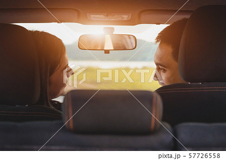 Back view of Asian couple looking each other in Back view of Asian couple looking each other in 57726558