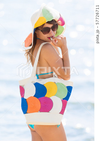 Elegant slim girl by the sea 57726711