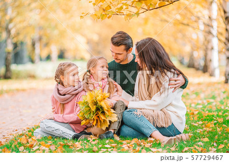 Portrait of happy family of four in autumn day 57729467