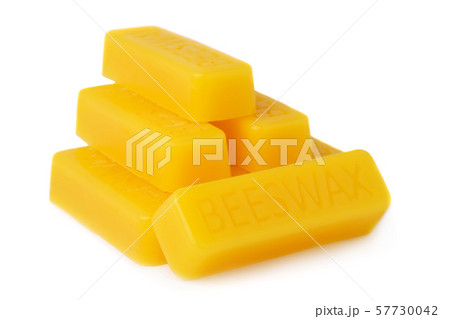 Bars of natural beeswax are isolated on a white background. Beekeeping products. Apitherapy. 57730042