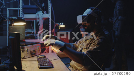 Soldier using VR headset and gloves Soldier using VR headset and gloves 57730590