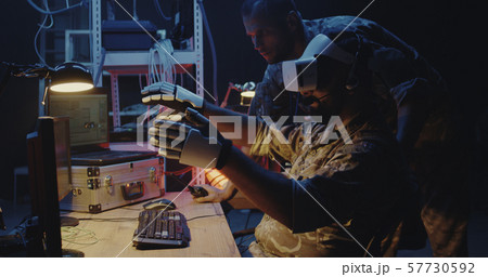 Soldier using VR headset and gloves 57730592