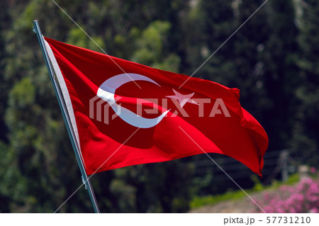 red flag of Turkey waving n street on a green background 57731210