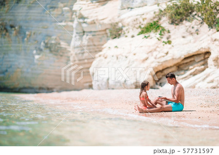 Beautiful father and daughter on european beach 57731597