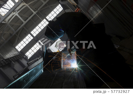 Industrial Worker at the factory welding closeup long exposure sparks 57732927