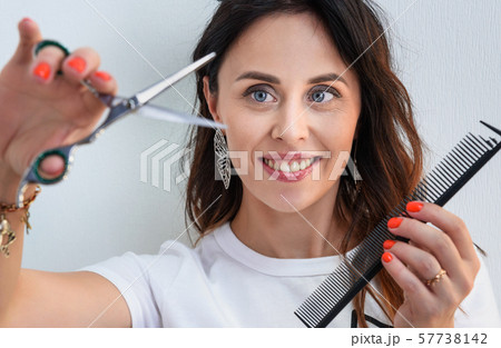 Professional hairdresser girl with comb and 57738142