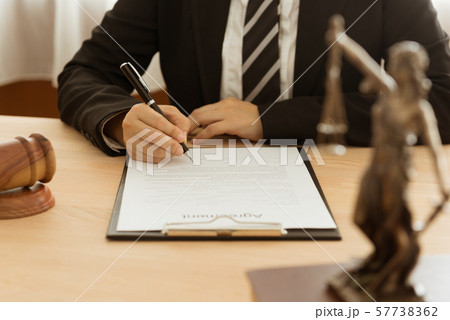 lawyer signing legal document 57738362