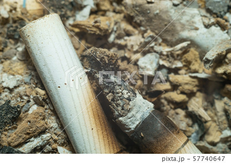 Close up of ashtray with cigarette ash and burned 57740647