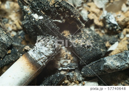 Close up of ashtray with cigarette ash and burned 57740648
