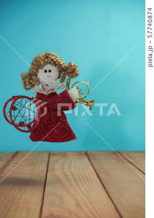 Beautiful Christmas bauble angel toy on a  and 57740874