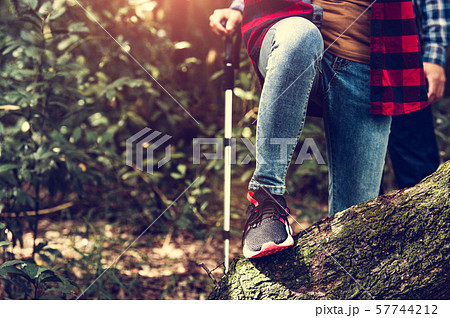 Closeup of female traveler legs and team group Closeup of female traveler legs and team group 57744212