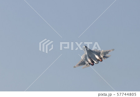 A military fighter jet flying in the gray sky A military fighter jet flying in the gray sky 57744805