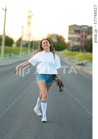 Street portrait of a girl in casual clothes and Street portrait of a girl in casual clothes and 57748027