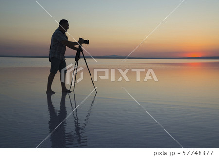 Sunset, lake and photgrapher 57748377