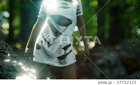young woman in torn t-shirt in green forest young woman in torn t-shirt in green forest 57752125