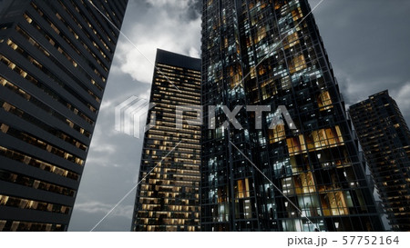 Glass Skyscrpaer Office Buildings with dark sky Glass Skyscrpaer Office Buildings with dark sky 57752164