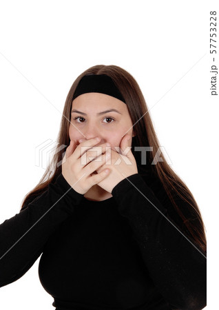 Surprised girl holding her hands over her mouths 57753228
