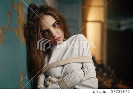Female patient in strait jacket, mental hospital Female patient in strait jacket, mental hospital 57755370