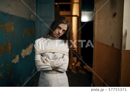 Female patient in strait jacket, mental hospital 57755371