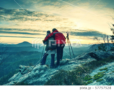 Nature photographers in red and light jacket take Nature photographers in red and light jacket take 57757528