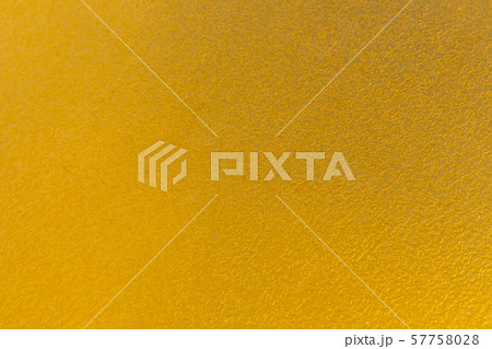 Textured uneven mustard surface on wall or object facade 57758028