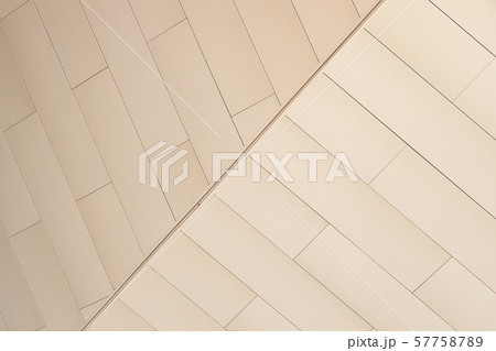 Angular view of beige color tiled wall of refracted relief Angular view of beige color tiled wall of refracted relief 57758789